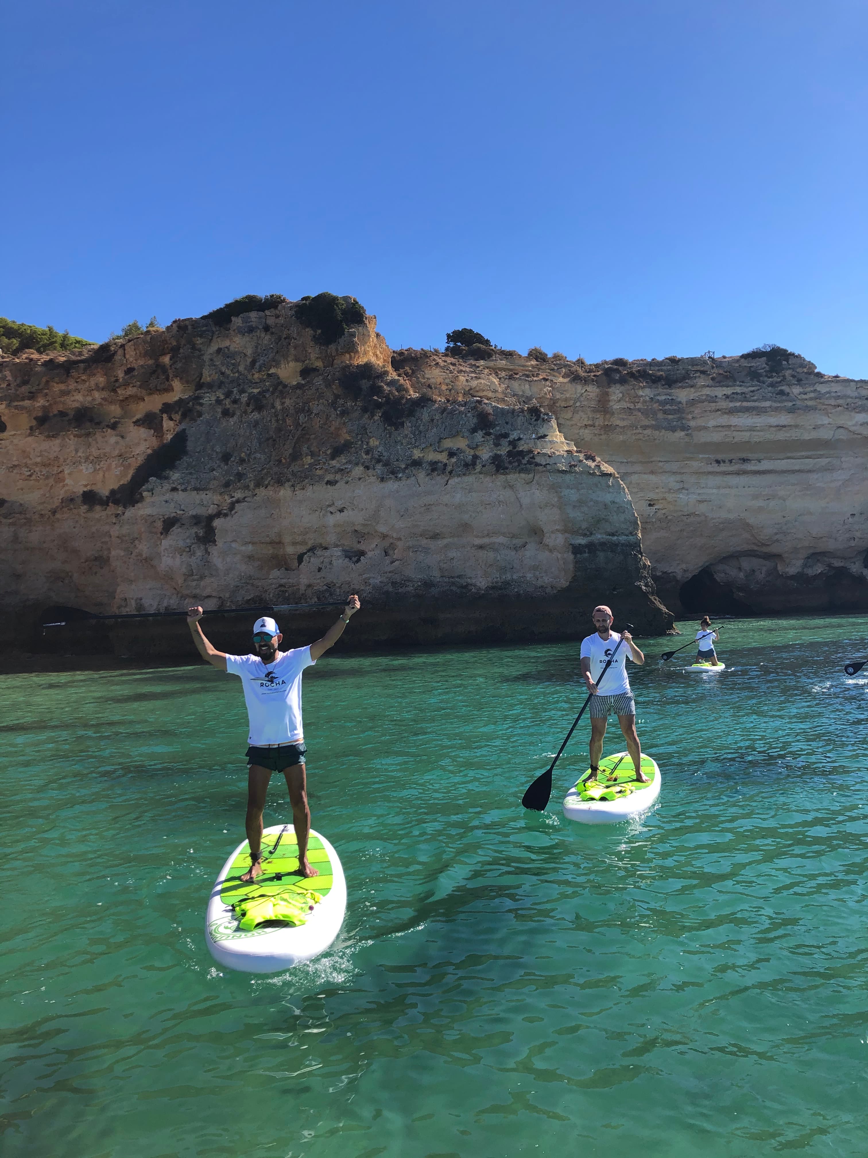 People on SUP boards paddling in the sea